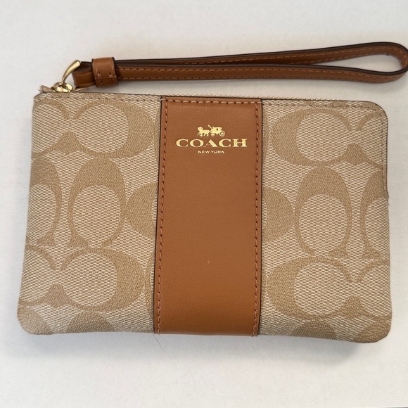 Coach Handbags - COACH Wristlet in Beige and Brown Leather Signature Logo
